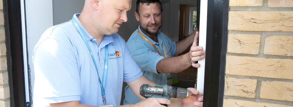 Eastlight staff fixing a resident's door